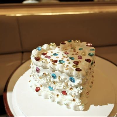 Heart-shaped bedazzled cake