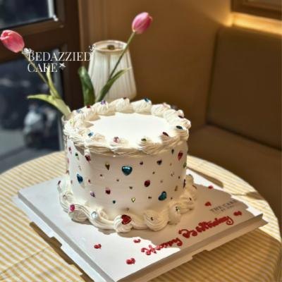Bedazzled birthday cake with jewel decorations