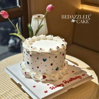 Facebook post: bedazzled cake with tulips