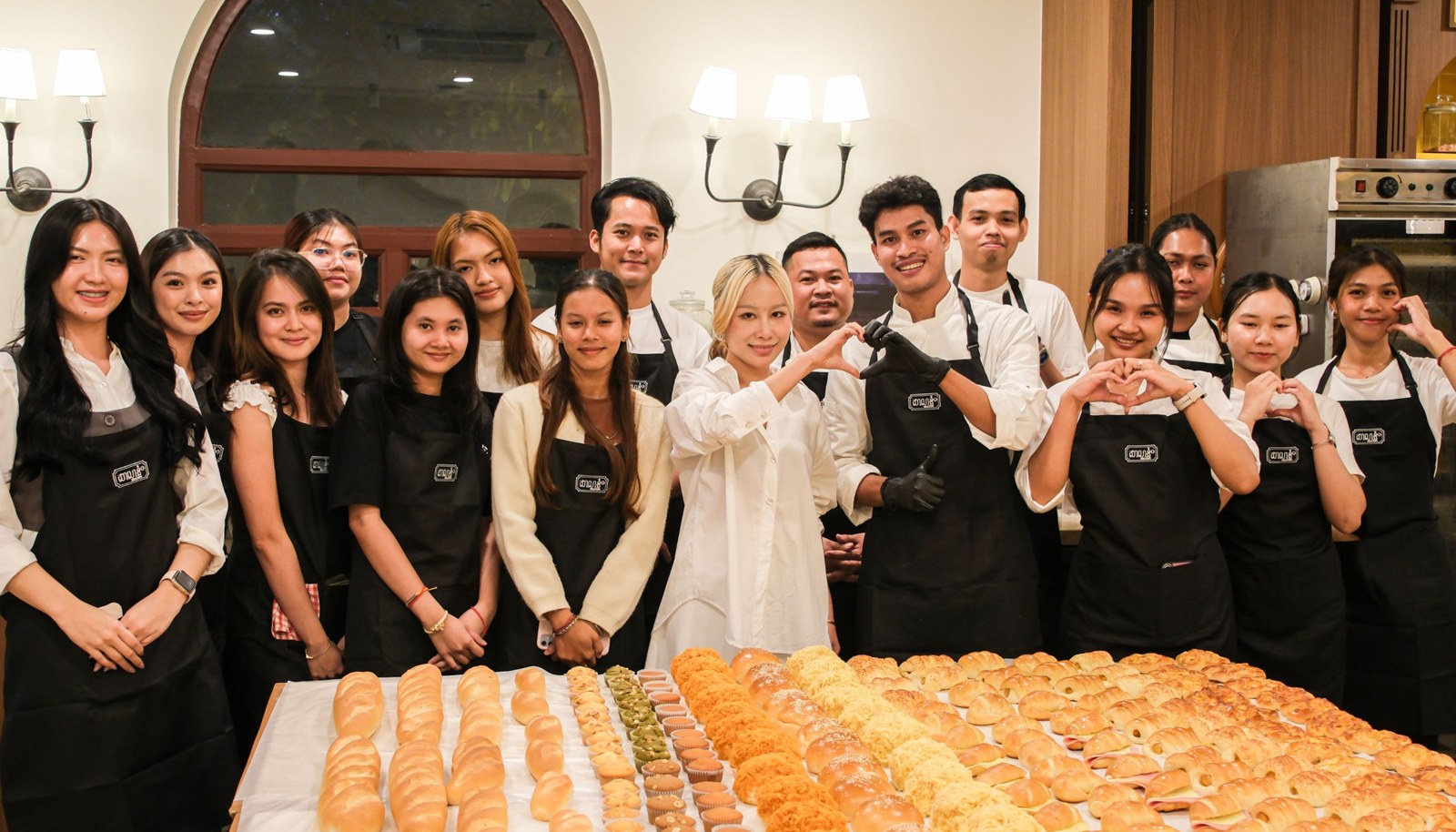 The Salanum team and students behind a table of fresh bread